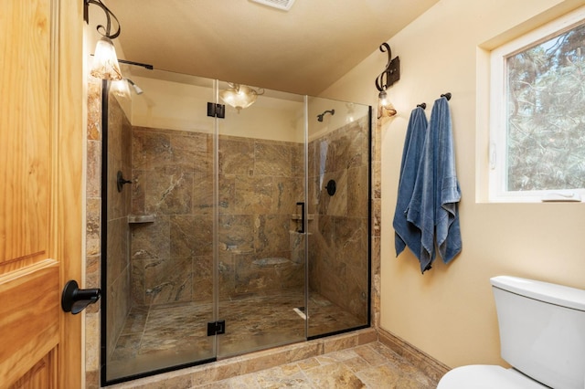 38303 Woodland Rd, Shaver Lake, CA 93664 - full bath featuring a stall shower, plenty of natural light, and stone finish floors