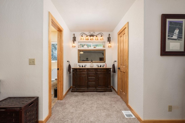 38303 Woodland Rd, Shaver Lake, CA 93664 - hall featuring light carpet and baseboards