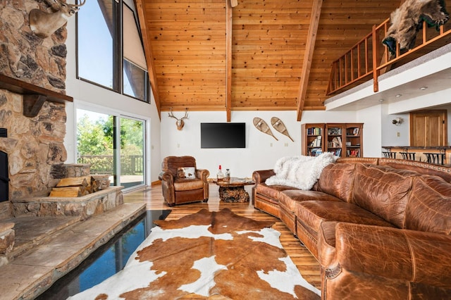 38303 Woodland Rd, Shaver Lake, CA 93664 - living area featuring high vaulted ceiling, a wooden ceiling with exposed beams, and wood finished floors