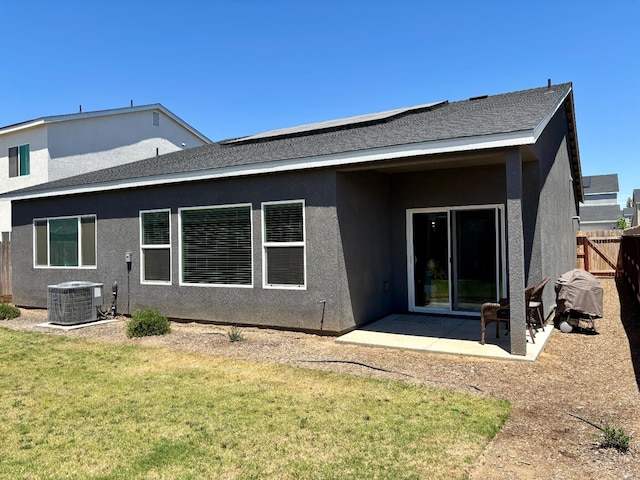 6423 E Robinson, Fresno, CA 93727 - back of property with central AC, stucco siding, and a patio area