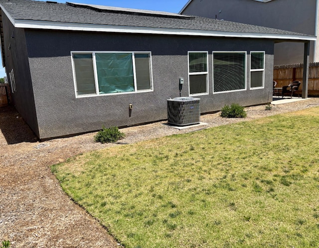 6423 E Robinson, Fresno, CA 93727 - back of property featuring central AC, a patio, and stucco siding