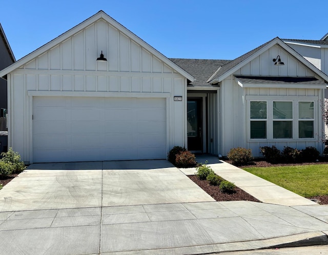 6423 E Robinson, Fresno, CA 93727 - view of front of property featuring board and batten siding, concrete driveway, a shingled roof, and a garage
