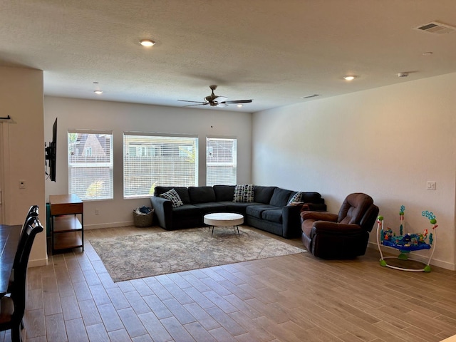 6423 E Robinson, Fresno, CA 93727 - living room with a ceiling fan, wood finished floors, baseboards, and recessed lighting