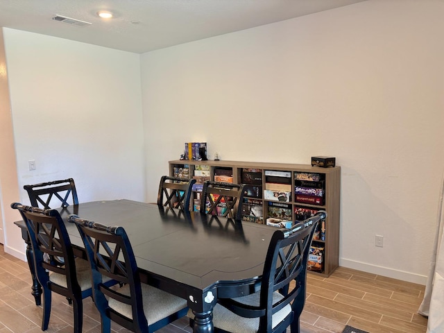 6423 E Robinson, Fresno, CA 93727 - dining space featuring baseboards and light wood-style floors