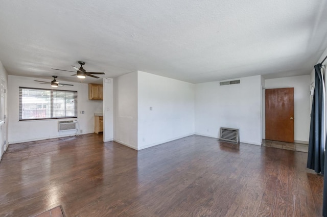 1205 W Clinton Ave, Fresno, CA 93705 - unfurnished living room with dark wood-style flooring, a ceiling fan, baseboards, and a wall mounted AC