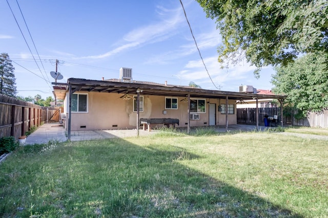 1205 W Clinton Ave, Fresno, CA 93705 - rear view of house with crawl space, a patio, and central AC unit