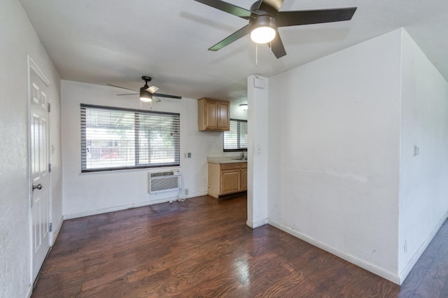 1205 W Clinton Ave, Fresno, CA 93705 - unfurnished living room with a ceiling fan, dark wood finished floors, a wall mounted air conditioner, and baseboards