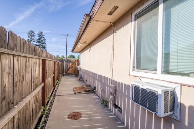 1205 W Clinton Ave, Fresno, CA 93705 - view of side of property featuring a fenced backyard, stucco siding, and cooling unit