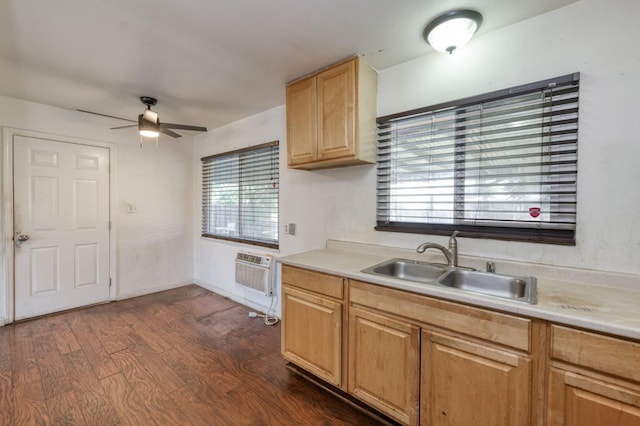 1205 W Clinton Ave, Fresno, CA 93705 - kitchen with a sink, a wall unit AC, a ceiling fan, light countertops, and dark wood-type flooring