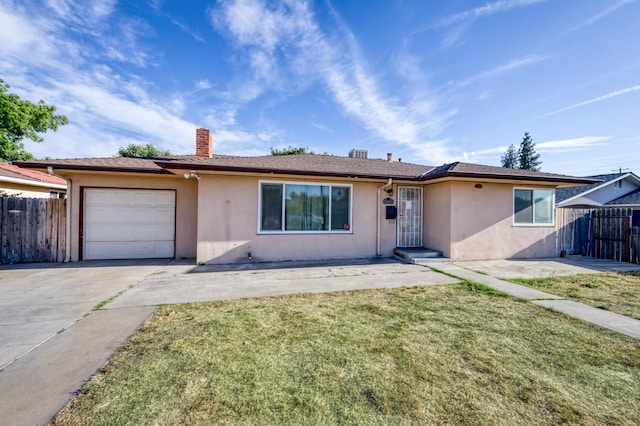 1205 W Clinton Ave, Fresno, CA 93705 - single story home featuring stucco siding, driveway, an attached garage, and a chimney
