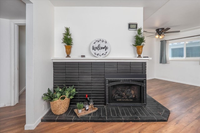 4003 E Fedora Ave, Fresno, CA 93726 - detailed view of a fireplace, wood finished floors, and ceiling fan