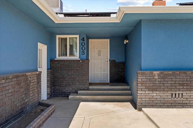 4003 E Fedora Ave, Fresno, CA 93726 - entrance to property featuring stucco siding, a chimney, and brick siding