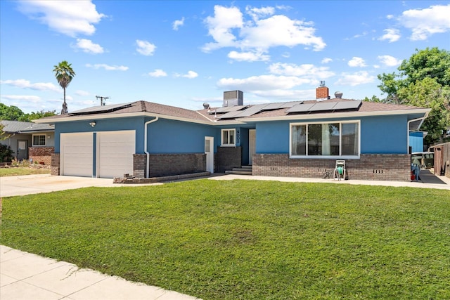 4003 E Fedora Ave, Fresno, CA 93726 - view of front of home featuring brick siding, a garage, and a front yard