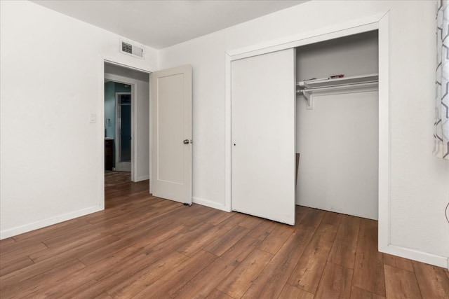 4003 E Fedora Ave, Fresno, CA 93726 - unfurnished bedroom with wood-type flooring, a closet, and baseboards