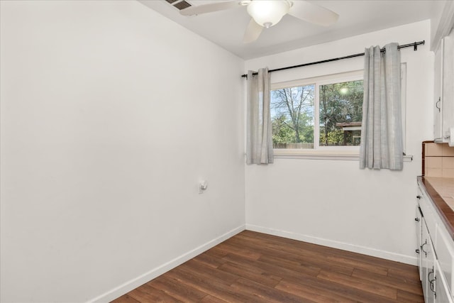 4003 E Fedora Ave, Fresno, CA 93726 - empty room with dark wood finished floors and a ceiling fan