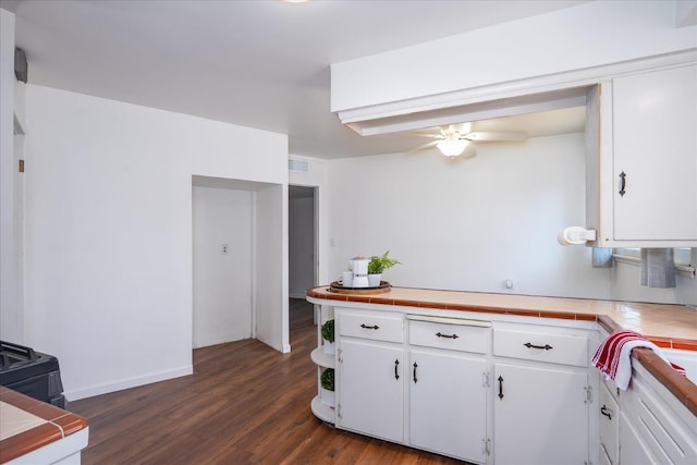 4003 E Fedora Ave, Fresno, CA 93726 - kitchen featuring tile counters, white cabinetry, ceiling fan, and dark wood-style floors