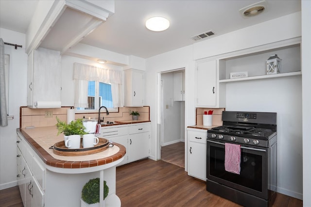 4003 E Fedora Ave, Fresno, CA 93726 - kitchen with black gas stove, white cabinetry, tasteful backsplash, tile counters, and open shelves