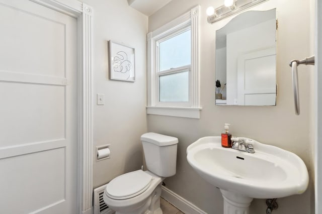 315 E Clinton Ave, Fresno, CA 93704 - half bathroom with toilet, a sink, and baseboards