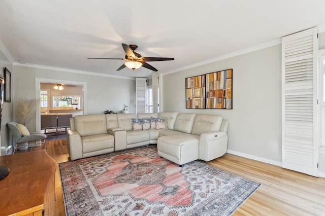 315 E Clinton Ave, Fresno, CA 93704 - living room with a ceiling fan, wood finished floors, ornamental molding, and baseboards