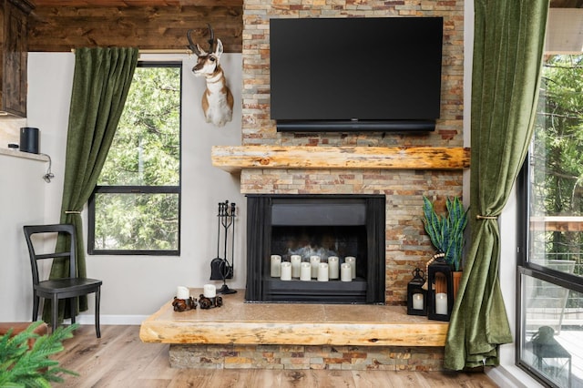 41831 Saddleback Rd, Shaver Lake, CA 93664 - detailed view of wood finished floors, a large fireplace, and baseboards