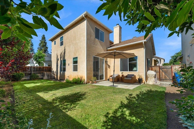 1780 N Avignon Ln, Clovis, CA 93619 - back of house featuring stucco siding, a patio area, a chimney, and a gate