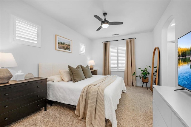 1780 N Avignon Ln, Clovis, CA 93619 - bedroom with arched walkways, ceiling fan, and light carpet