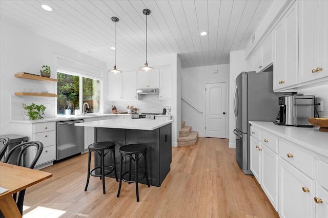 1780 N Avignon Ln, Clovis, CA 93619 - kitchen featuring stainless steel appliances, wooden ceiling, a breakfast bar, white cabinets, and recessed lighting