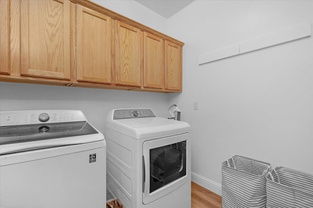1780 N Avignon Ln, Clovis, CA 93619 - washroom featuring separate washer and dryer, cabinet space, light wood finished floors, and baseboards