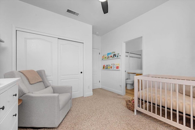 1780 N Avignon Ln, Clovis, CA 93619 - bedroom with a closet, a nursery area, light carpet, a ceiling fan, and baseboards