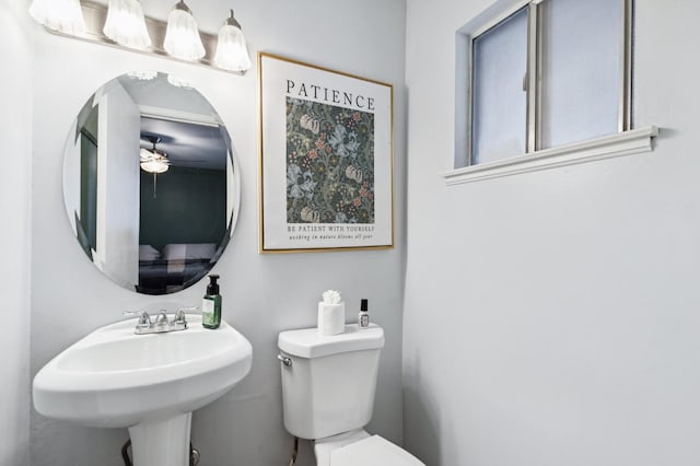 119 Magnolia Ave, Lemoore, CA 93245 - half bathroom with toilet, ceiling fan, and a sink