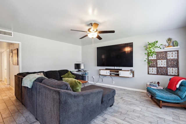 119 Magnolia Ave, Lemoore, CA 93245 - living area with wood finished floors, ceiling fan, and baseboards