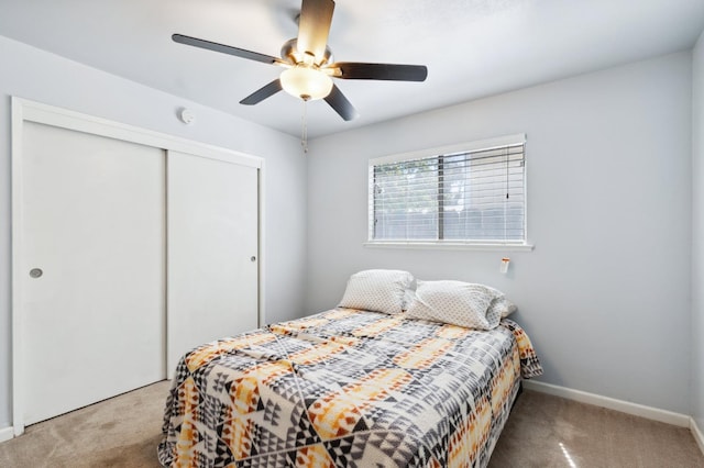 119 Magnolia Ave, Lemoore, CA 93245 - bedroom featuring carpet flooring, a closet, baseboards, and a ceiling fan
