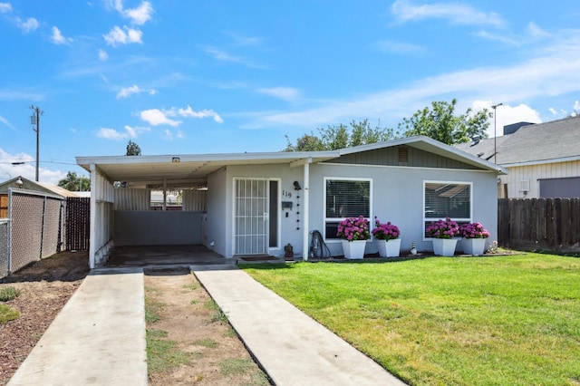 119 Magnolia Ave, Lemoore, CA 93245 - view of front of house featuring driveway and a carport