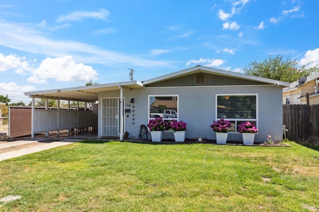 119 Magnolia Ave, Lemoore, CA 93245 - view of front of home with a carport, concrete driveway, and stucco siding