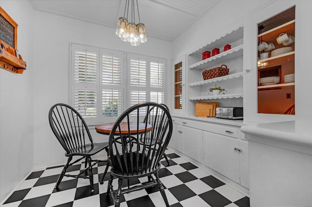 739 E Harvard Ave, Fresno, CA 93704 - dining space featuring dark flooring, a chandelier, and built in shelves
