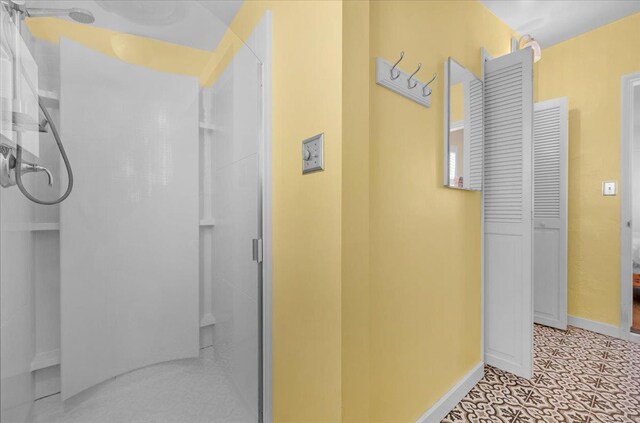 739 E Harvard Ave, Fresno, CA 93704 - bathroom with a stall shower and baseboards