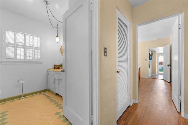 739 E Harvard Ave, Fresno, CA 93704 - corridor featuring healthy amount of natural light, baseboards, and wood finished floors
