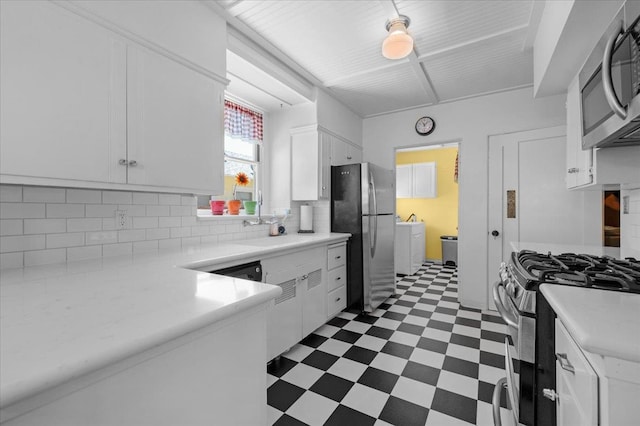 739 E Harvard Ave, Fresno, CA 93704 - kitchen with stainless steel appliances, tile patterned floors, white cabinetry, and backsplash