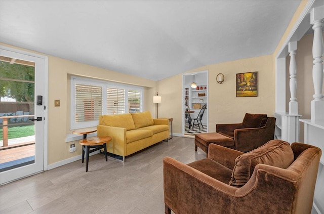 739 E Harvard Ave, Fresno, CA 93704 - living room featuring baseboards, vaulted ceiling, and light tile patterned floors