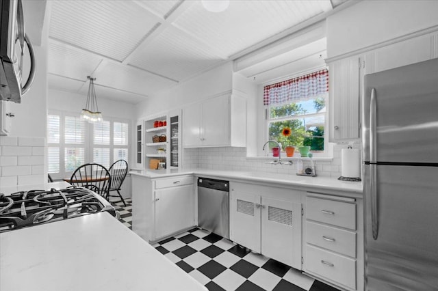 739 E Harvard Ave, Fresno, CA 93704 - kitchen featuring appliances with stainless steel finishes, light countertops, tasteful backsplash, and white cabinets