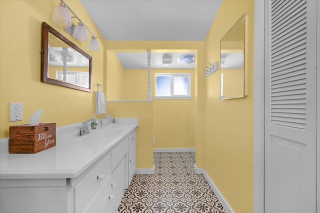 739 E Harvard Ave, Fresno, CA 93704 - bathroom with vanity, baseboards, and a closet