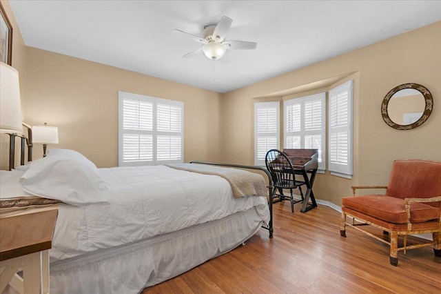 739 E Harvard Ave, Fresno, CA 93704 - bedroom featuring multiple windows, wood finished floors, baseboards, and ceiling fan