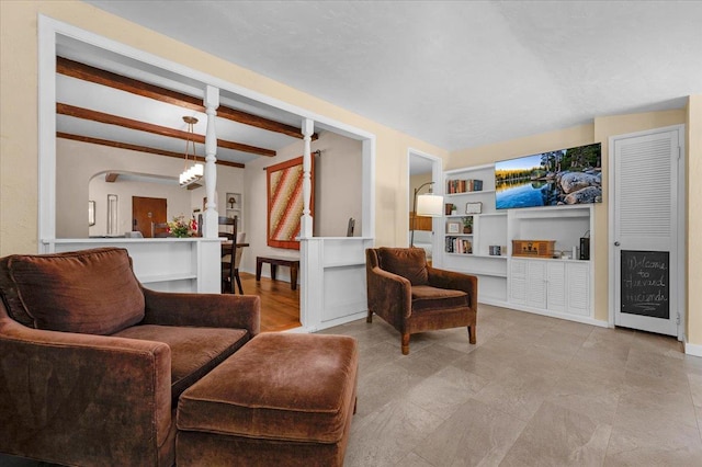 739 E Harvard Ave, Fresno, CA 93704 - living room featuring beamed ceiling, built in shelves, and baseboards