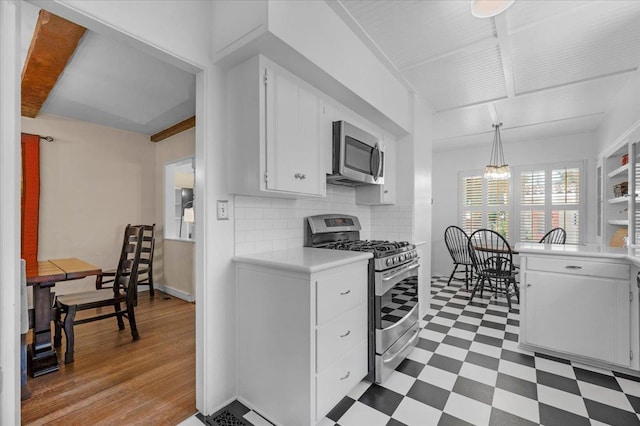 739 E Harvard Ave, Fresno, CA 93704 - kitchen featuring stainless steel appliances, tile patterned floors, light countertops, tasteful backsplash, and white cabinets