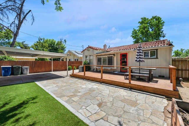 739 E Harvard Ave, Fresno, CA 93704 - rear view of property featuring a patio, a deck, a tile roof, and central AC unit