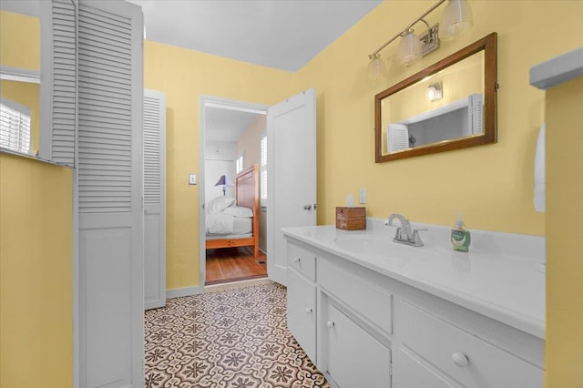 739 E Harvard Ave, Fresno, CA 93704 - bathroom with vanity, a closet, and connected bathroom