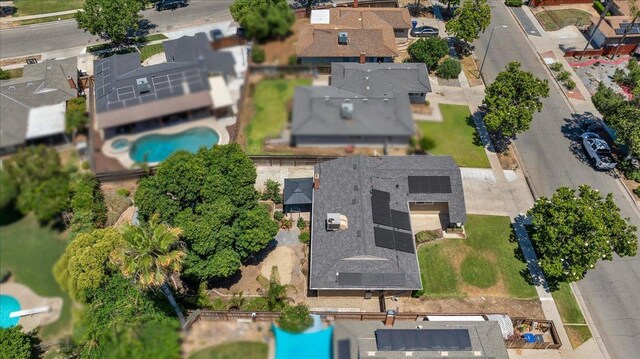 6569 N Kennedy Ave, Fresno, CA 93710 - aerial overview of property's location featuring a pool and nearby suburban area