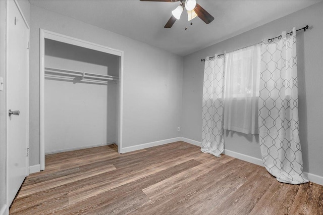 6569 N Kennedy Ave, Fresno, CA 93710 - unfurnished bedroom featuring wood finished floors, a closet, a ceiling fan, and baseboards