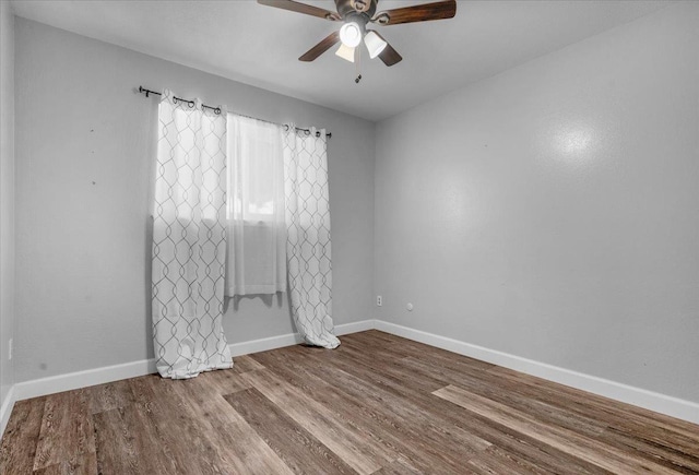 6569 N Kennedy Ave, Fresno, CA 93710 - unfurnished room with ceiling fan, wood finished floors, and baseboards