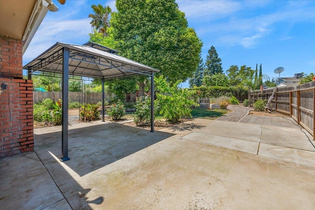 6569 N Kennedy Ave, Fresno, CA 93710 - fenced backyard with a gazebo and a patio area